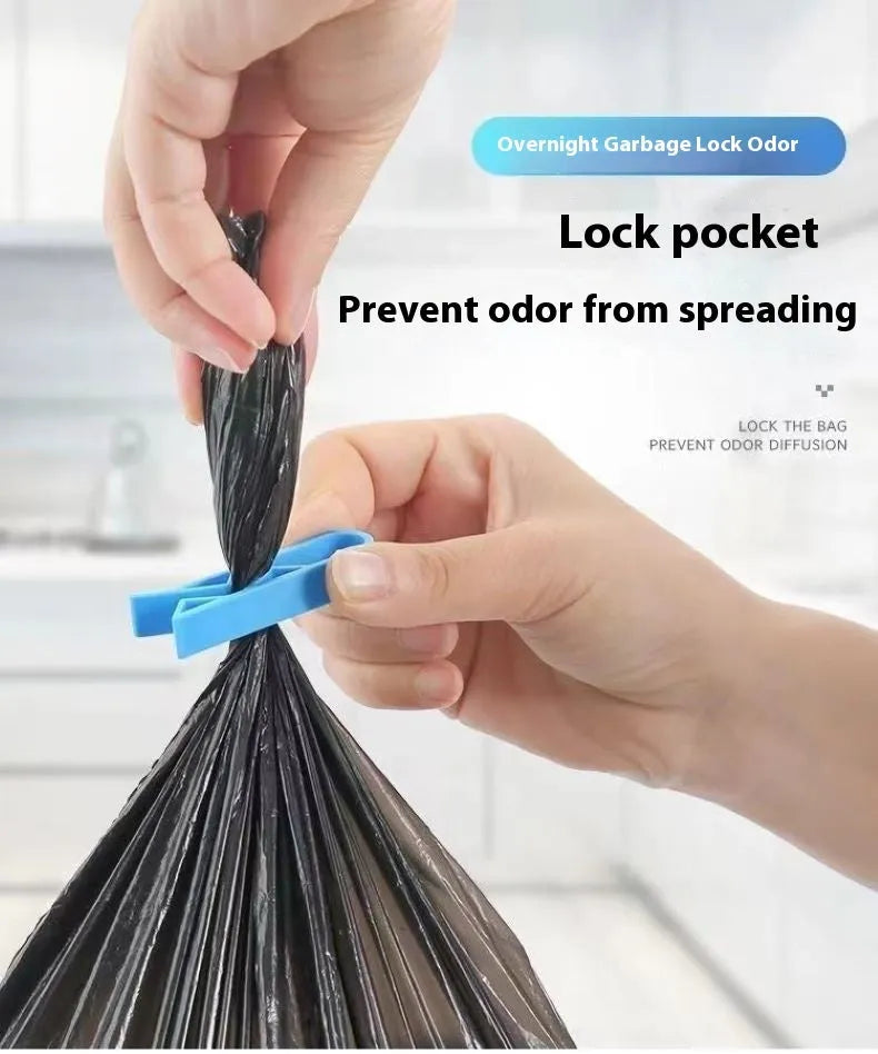 White PP plastic garbage bag fixing clip shown holding a black bin liner to the rim of a silver trash can.