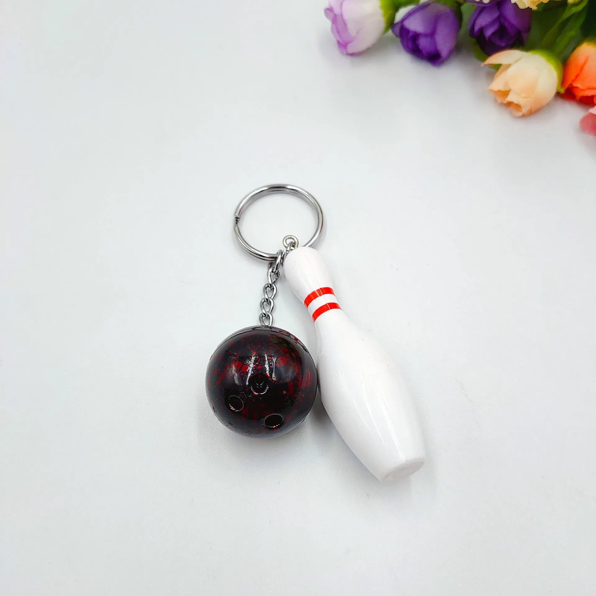 Mini bowling keychain pendant in four colour options on keyring