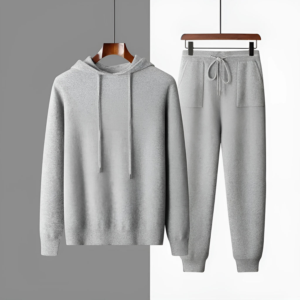 Men's light grey cashmere hooded sweatshirt and matching long pants laid flat.