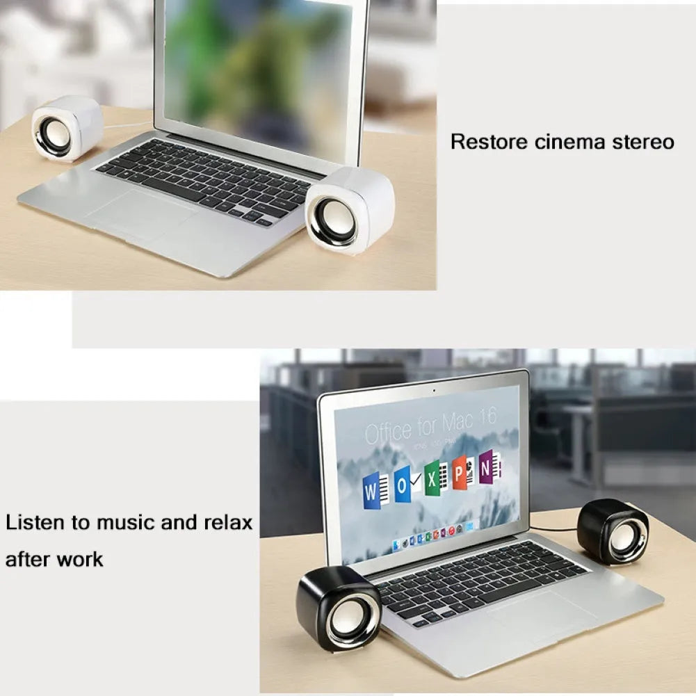 A pair of small black wired desktop computer speakers with a volume scroll wheel.