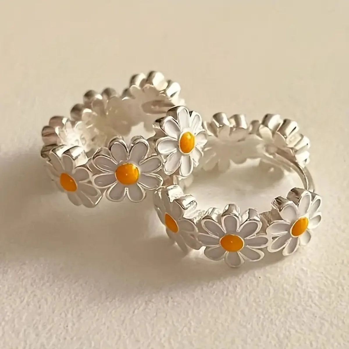 White daisy flower design earrings with electroplated finish on copper construction