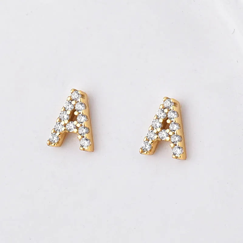 Single brass gold plated letter E earring with clear zircon stone and copper post backing