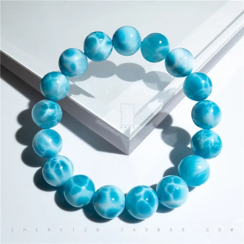 Blue bodhi bracelet with sea-pattern crystal stone and pearl accents in Maillard style.