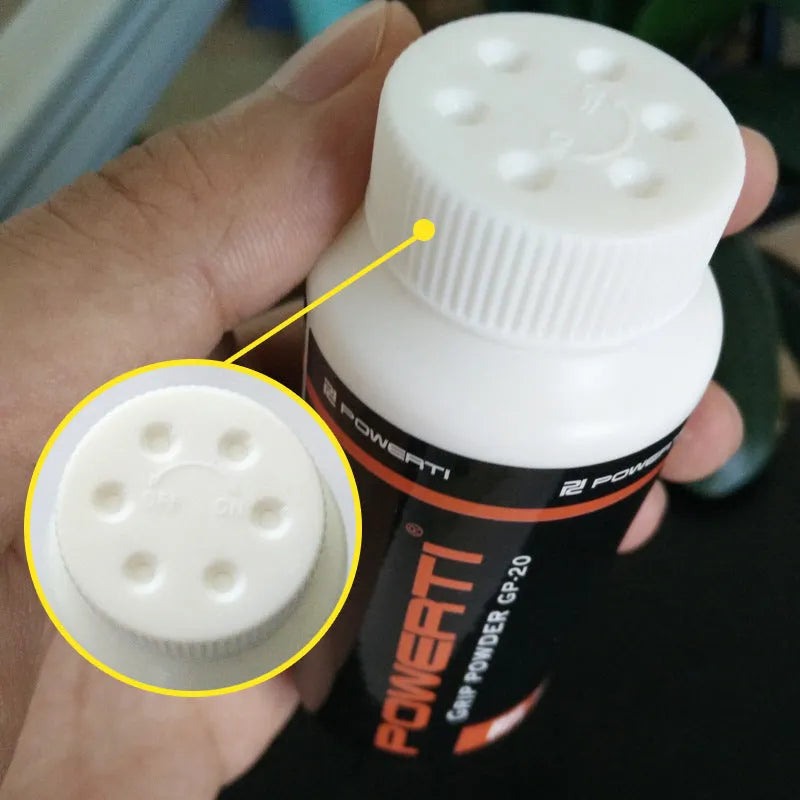 White magnesium carbonate anti-slip powder in container for sports grip.