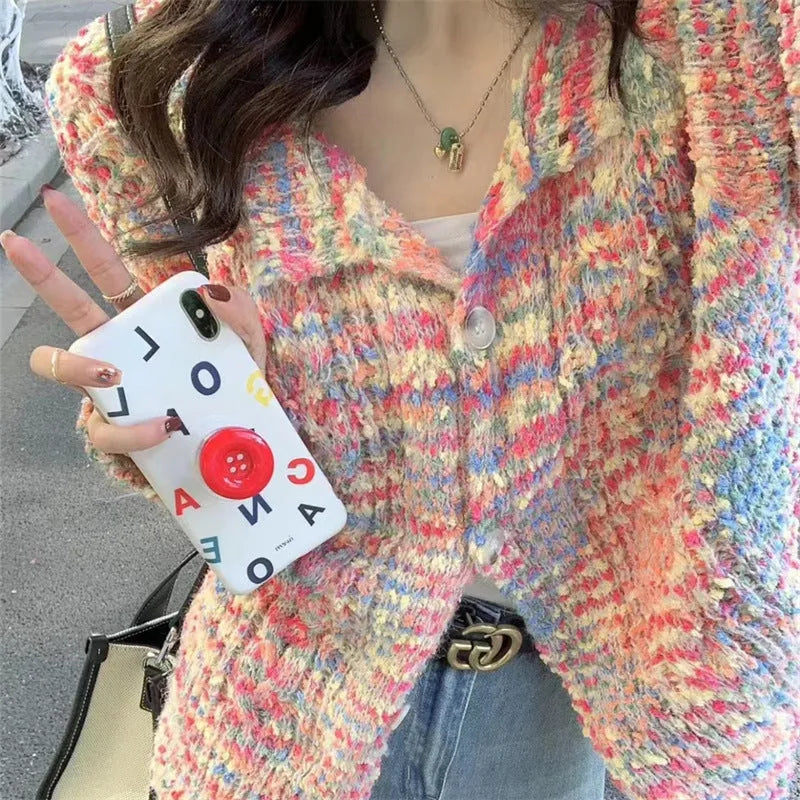 Retro style knitted rainbow cardigan sweater in pink or green colour with toothbrush hair fabric texture