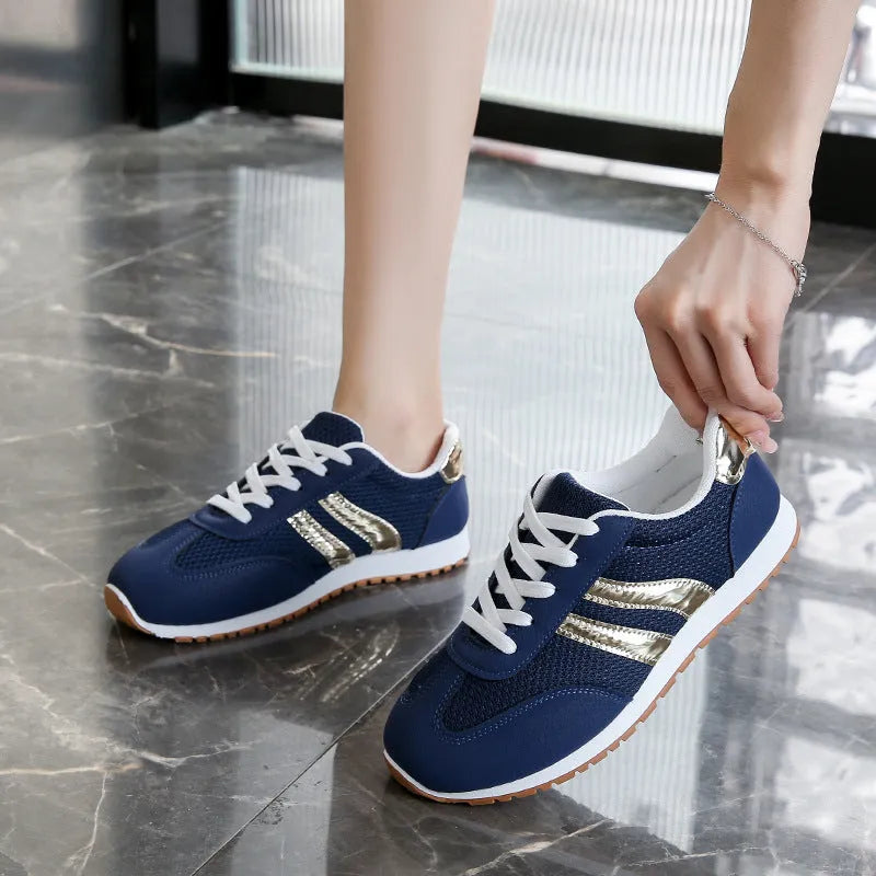 Blue women's casual sports trainers with cross shoulder straps and a white non-slip rubber sole.