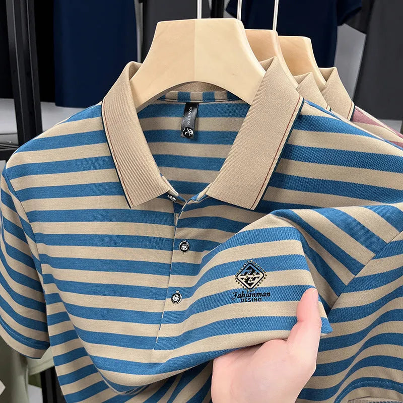 A man wearing a blue striped short sleeve casual top with a mosaic pattern design.