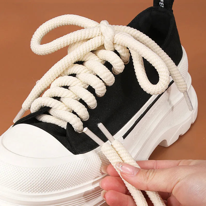 Solid colour round woven shoelaces showing white, black, and beige options with length and thickness choices
