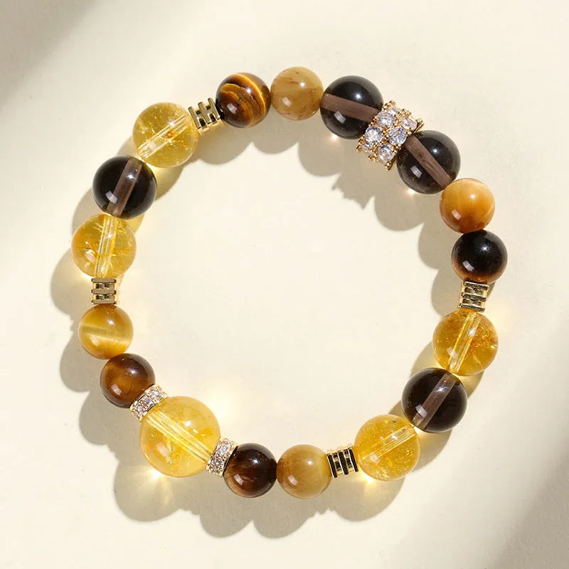 Natural yellow 10mm Jinba crystal beads on a handmade wrap bracelet.