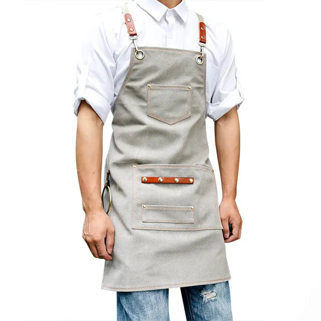 Canvas apron with cross strap back design in camel colour for baking and gardening protection