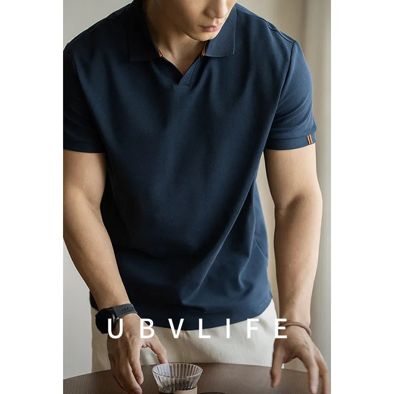 Blue short-sleeved casual polo shirt on a hanger showing the collar and button placket.