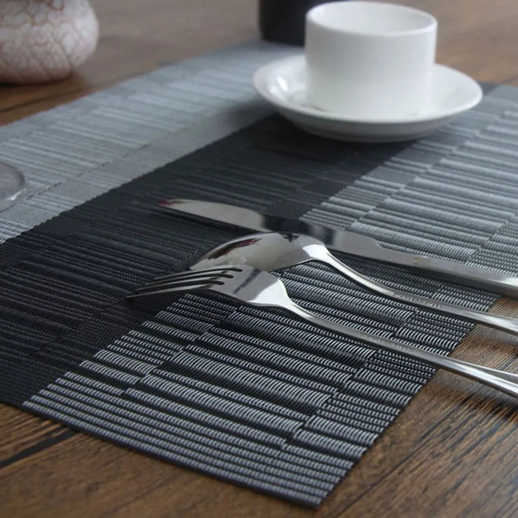 Modern PVC non-slip dish mat in gradient bamboo pattern placed in a kitchen sink.