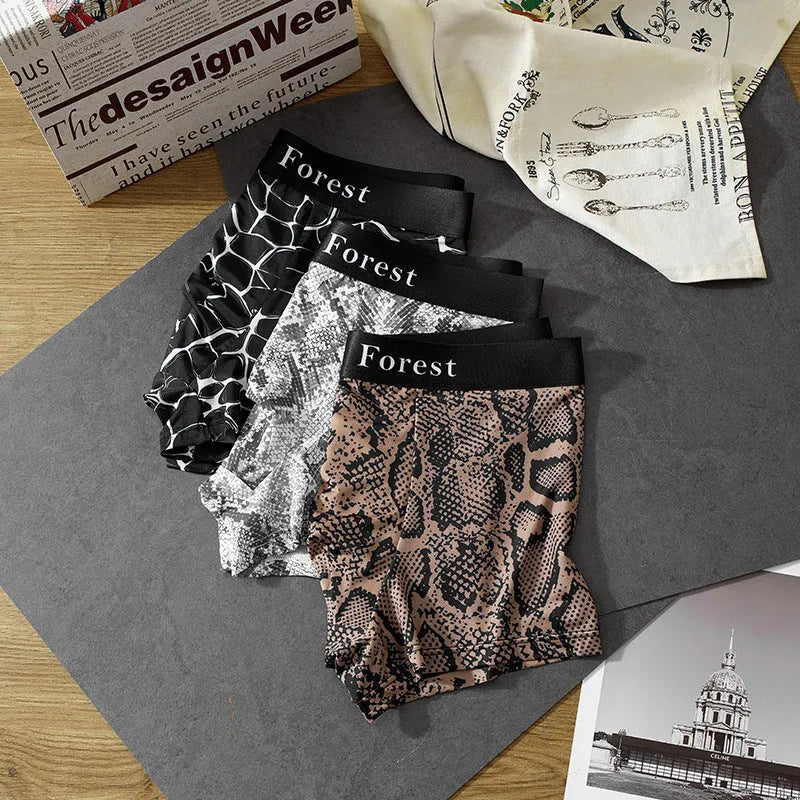 Men's loose-fit polyester boxer shorts in black, shown laid flat to display the thin fabric and mid-waist design.