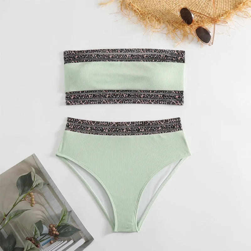 Black strapless bikini set with leopard print design, showing briefs-style shorts and top.