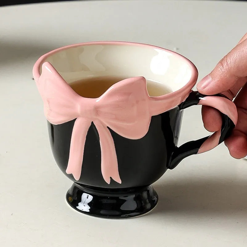 Ceramic heart bow design mug in white powder or black pink colour with 301-400ml capacity