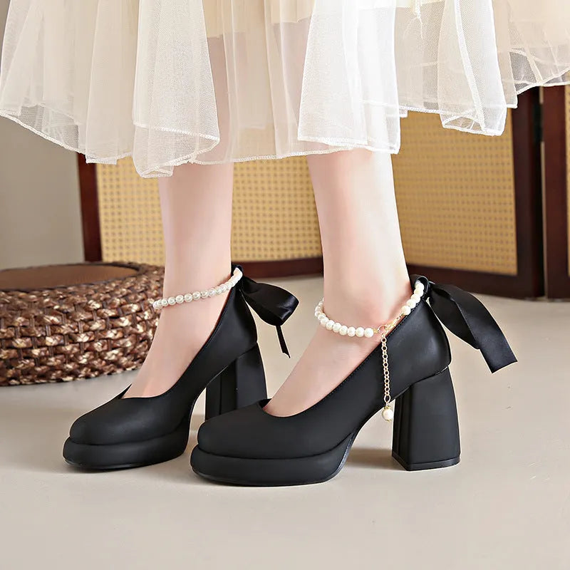 Beige women's Mary Jane shoes with chunky heel and ankle strap buckle on a white background
