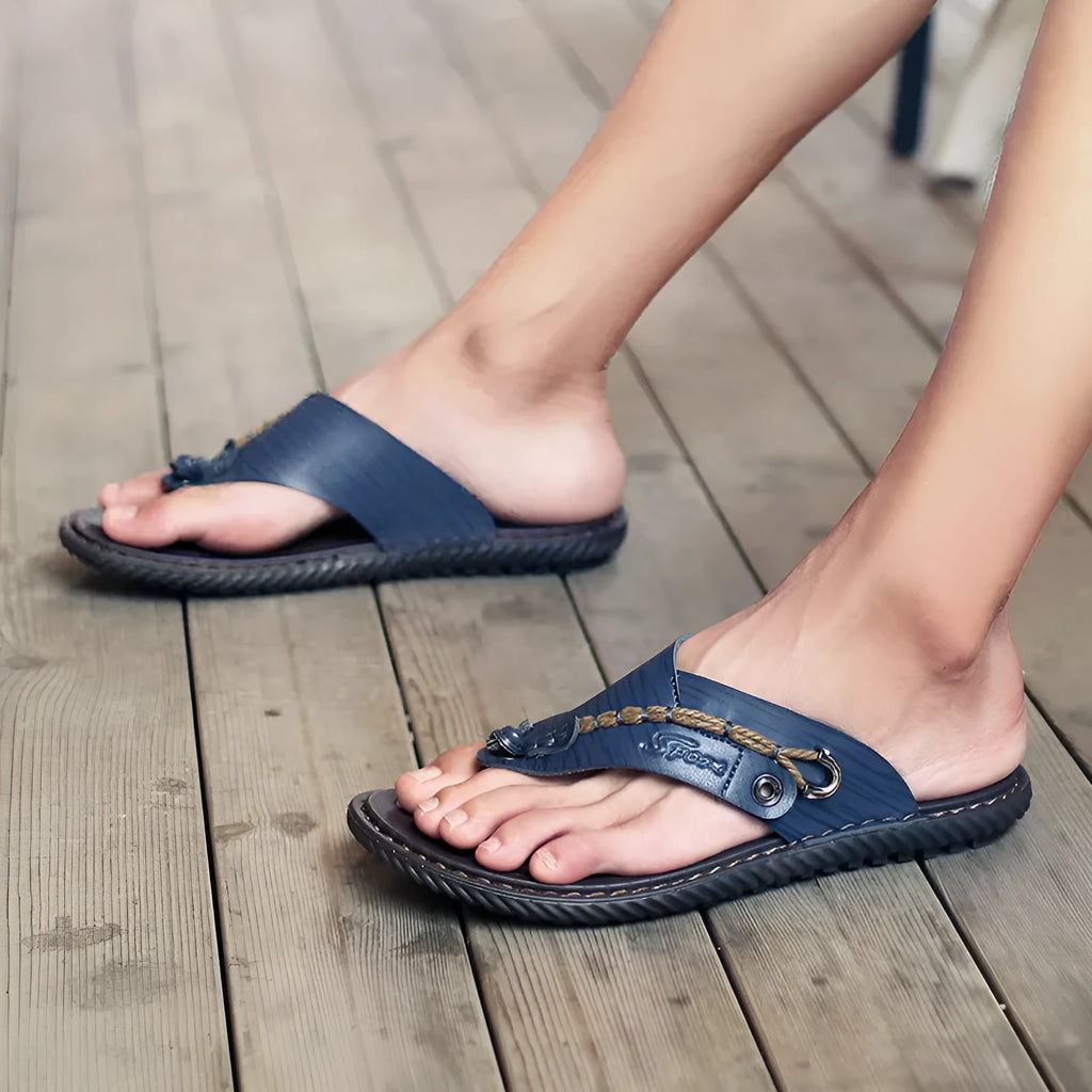 Men's non-slip casual slippers in blue PU leather, shown from the side.