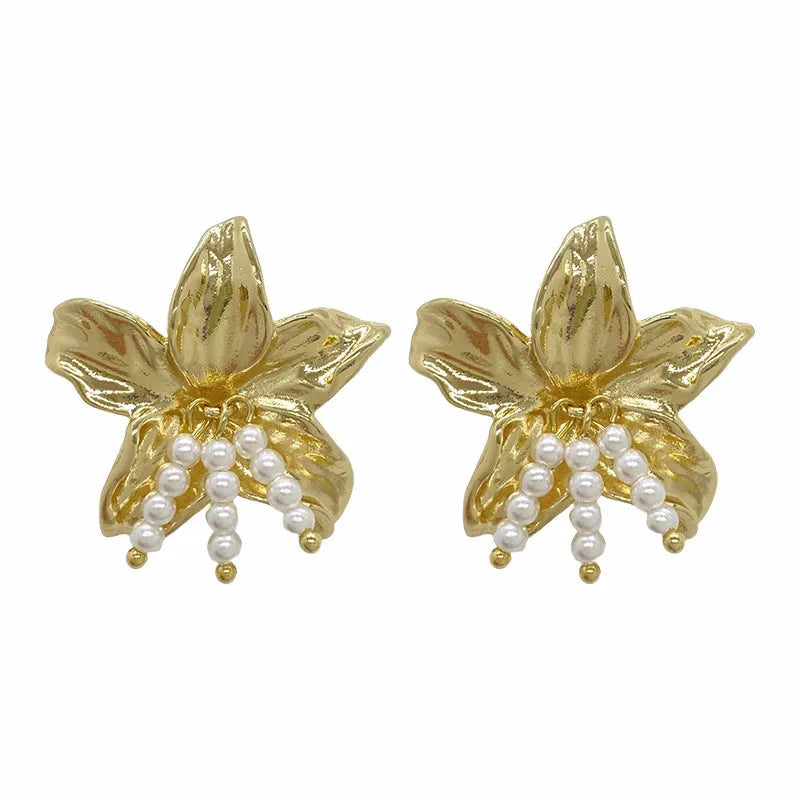 Gold H1795 pearl flower earrings with floral design on a white background.