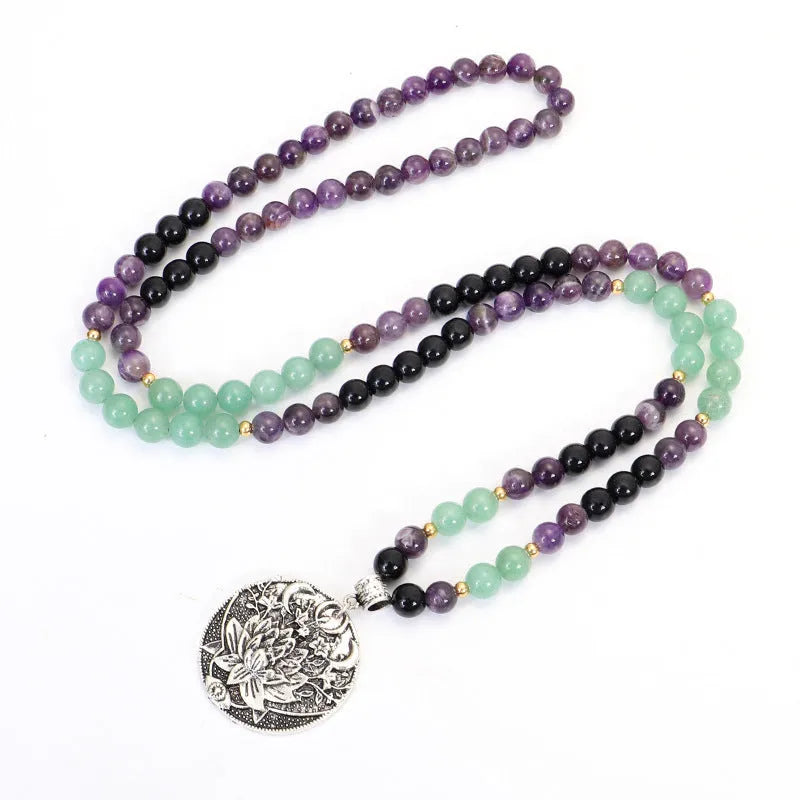 Yoga lotus pendant necklace and bracelet set with stone beads and geometric alloy pendant on adjustable chain.