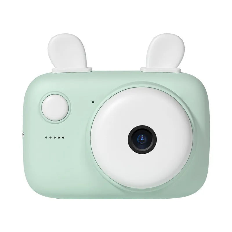 Green A2 kids digital camera with macaron-style SLR design and dual lenses on a table.