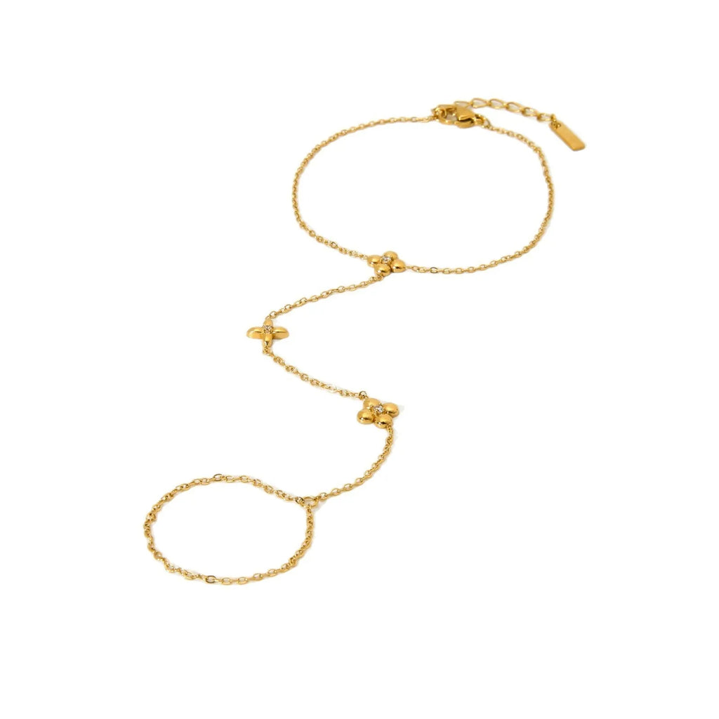 Gold-coloured women's bracelet with floral and eight-pointed star design on stainless steel