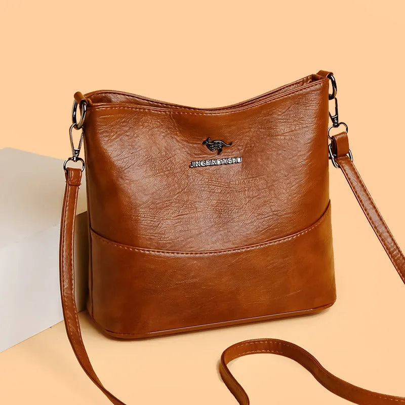 Women's soft leather shoulder bag in bucket shape with sewing line detailing and large capacity