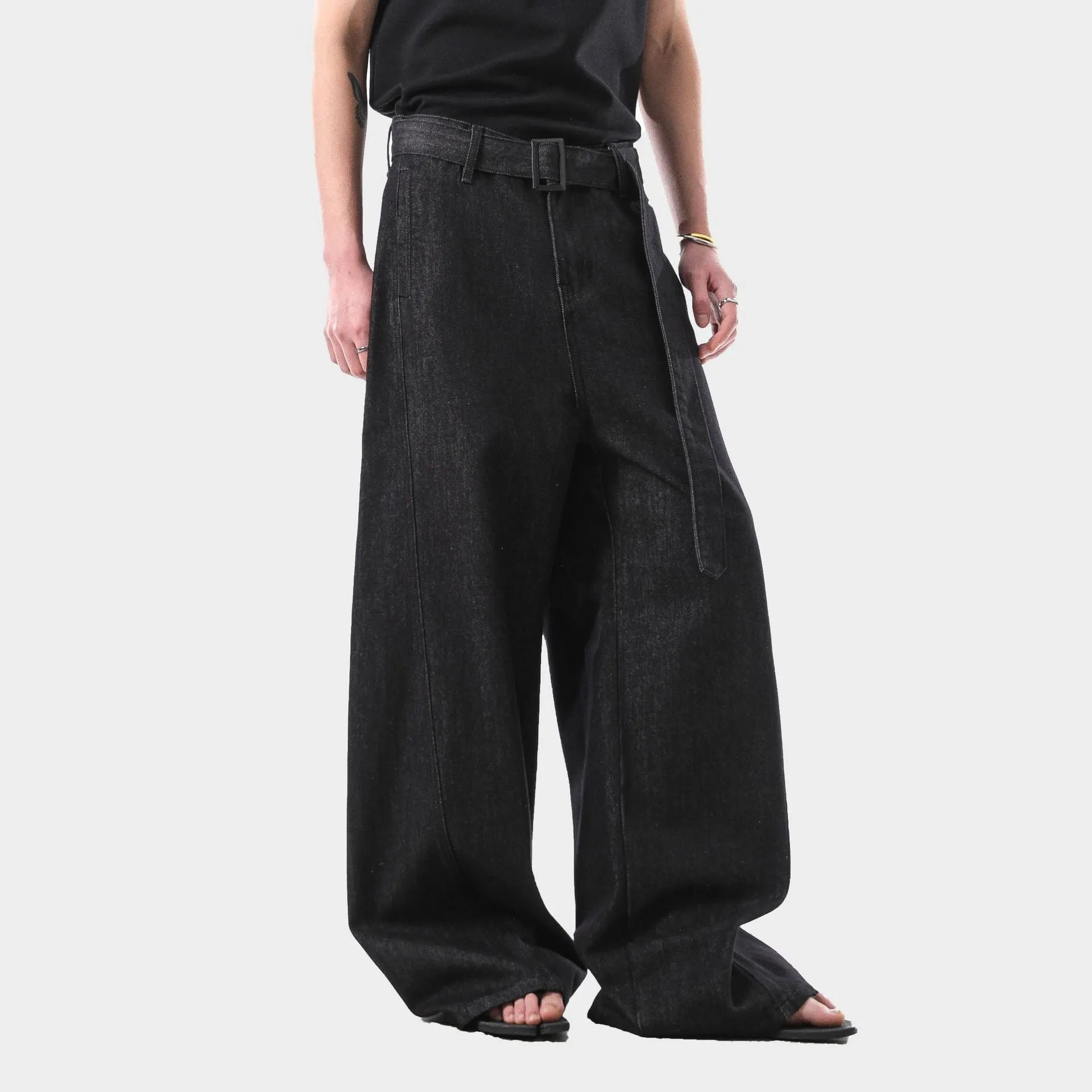 Black straight leg jeans with high waist and subtle gold metallic details, zip fly fastening
