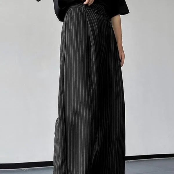 Men's black vertical striped pleated casual trousers with high elasticity fabric, laid flat.