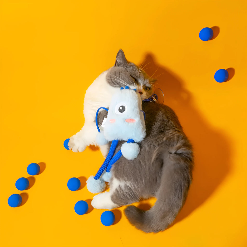 Blue telescopic elastic cat toy with plush attachments and mint bell on 30cm by 30cm background