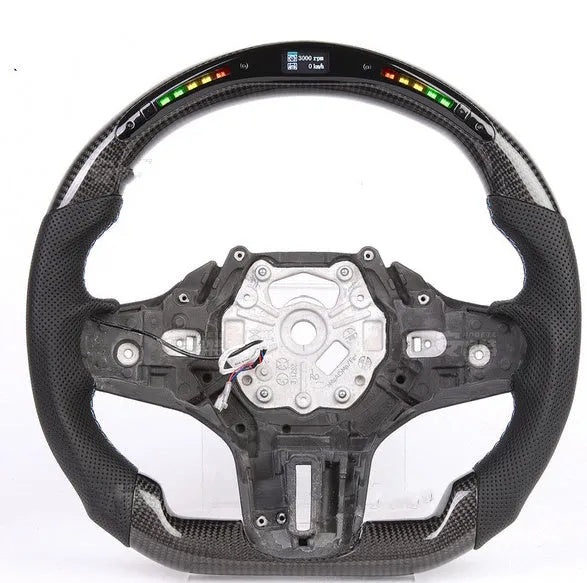 Black carbon fibre steering wheel for BMW with integrated LED display and heating function.