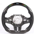 Black carbon fibre steering wheel for BMW with integrated LED display and heating function.