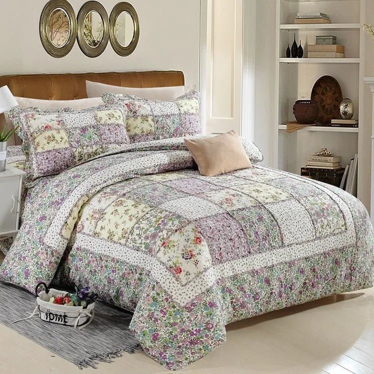 Washed pure cotton quilted bedspread and pillowcases three-piece bedding set on a bed.