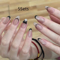 Set of assorted colourful fake nails for girls, showing multiple sets for dress-up play.