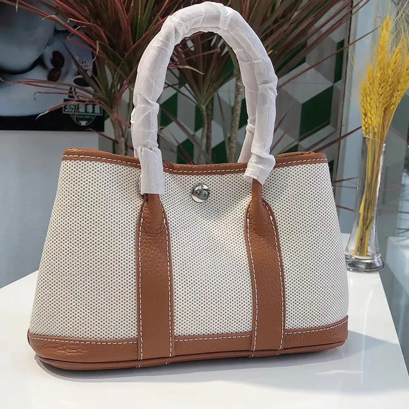 Women's canvas bucket tote bag with genuine leather details in 25cm and 30cm sizes