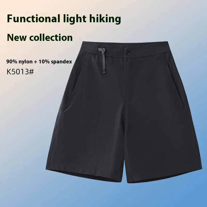 Man wearing khaki quick-drying sports shorts with an elastic waistband for running or climbing.