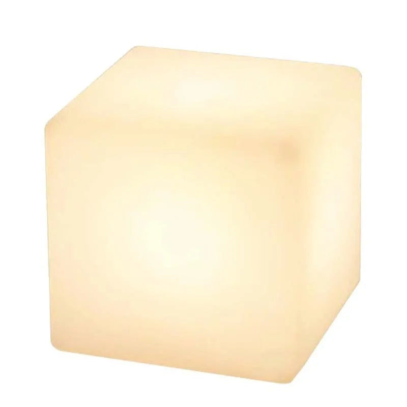 A modern square white LED cube stool light for outdoor garden use.