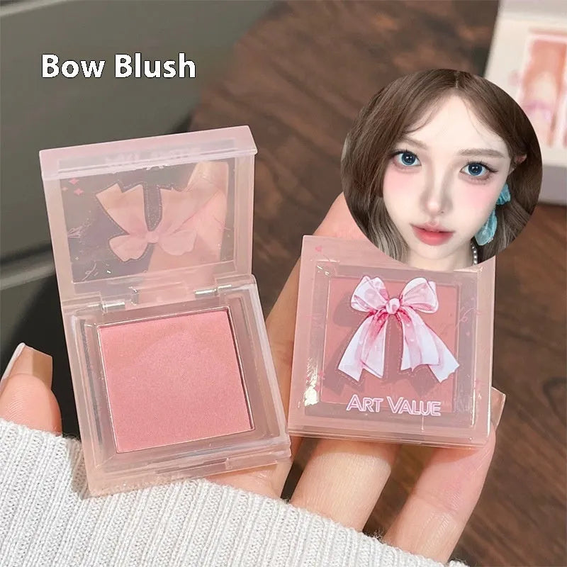Butterfly coloured makeup box with four pink lip mud containers, blush compact, and necklace