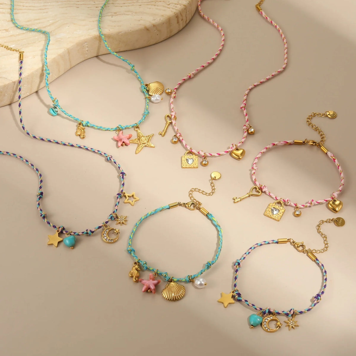 Handmade braided rope titanium steel necklace with a choice of purple moon, pink lock, or blue XINGX electroplated pendant.