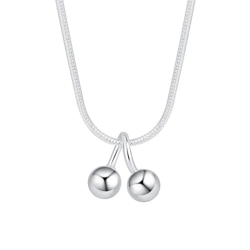 Silver cherry pendant necklace on a snake bone chain, adjustable from 21cm to 50cm.