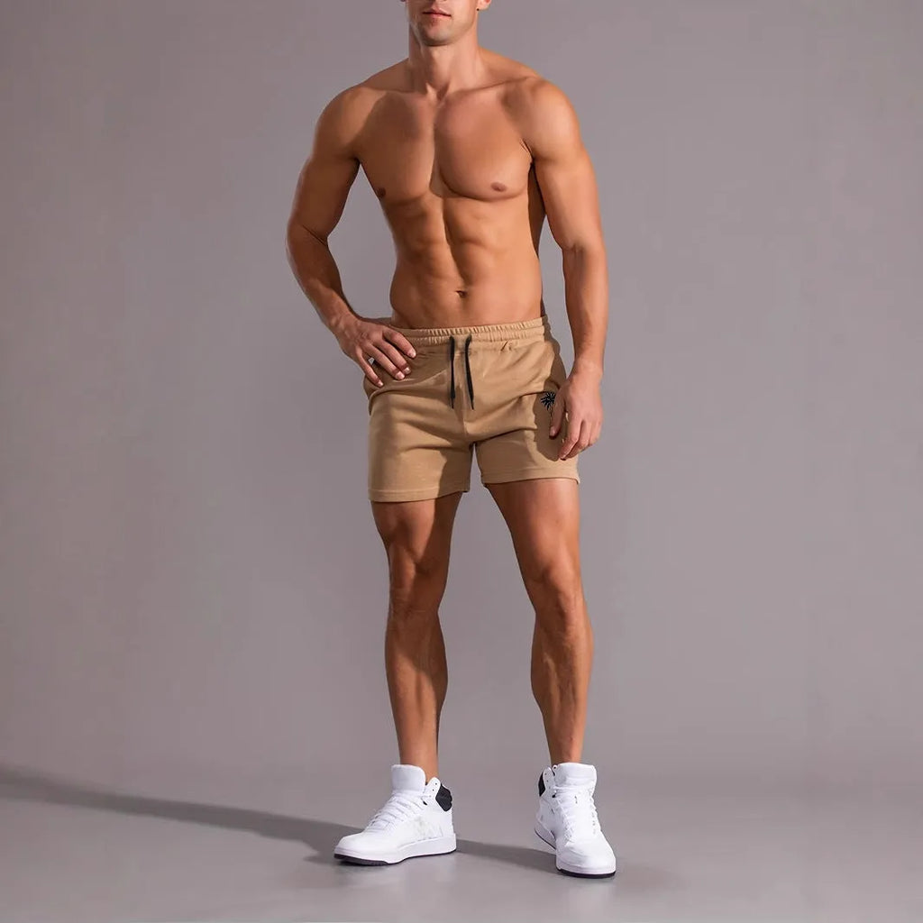 Men's khaki sports shorts with coconut leaf print pattern and straight leg design