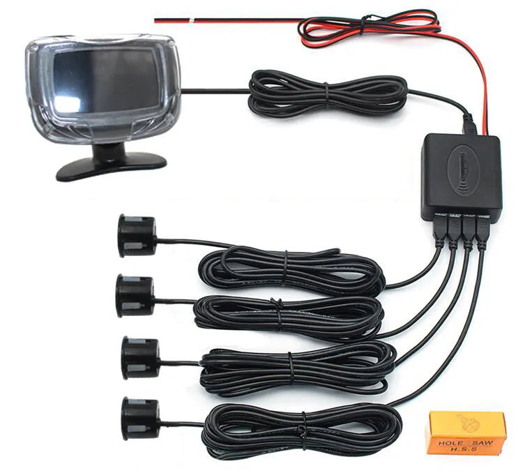 Wireless vehicle reversing sensor kit with digital display unit, four ultrasonic probes, and installation tools.