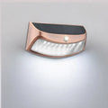 Solar outdoor wall lamp with smiling face design for garden lighting