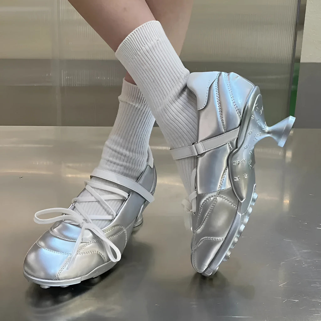 Women's silver lace-up bow sports shoes with round toe and mid-heel on a white background.