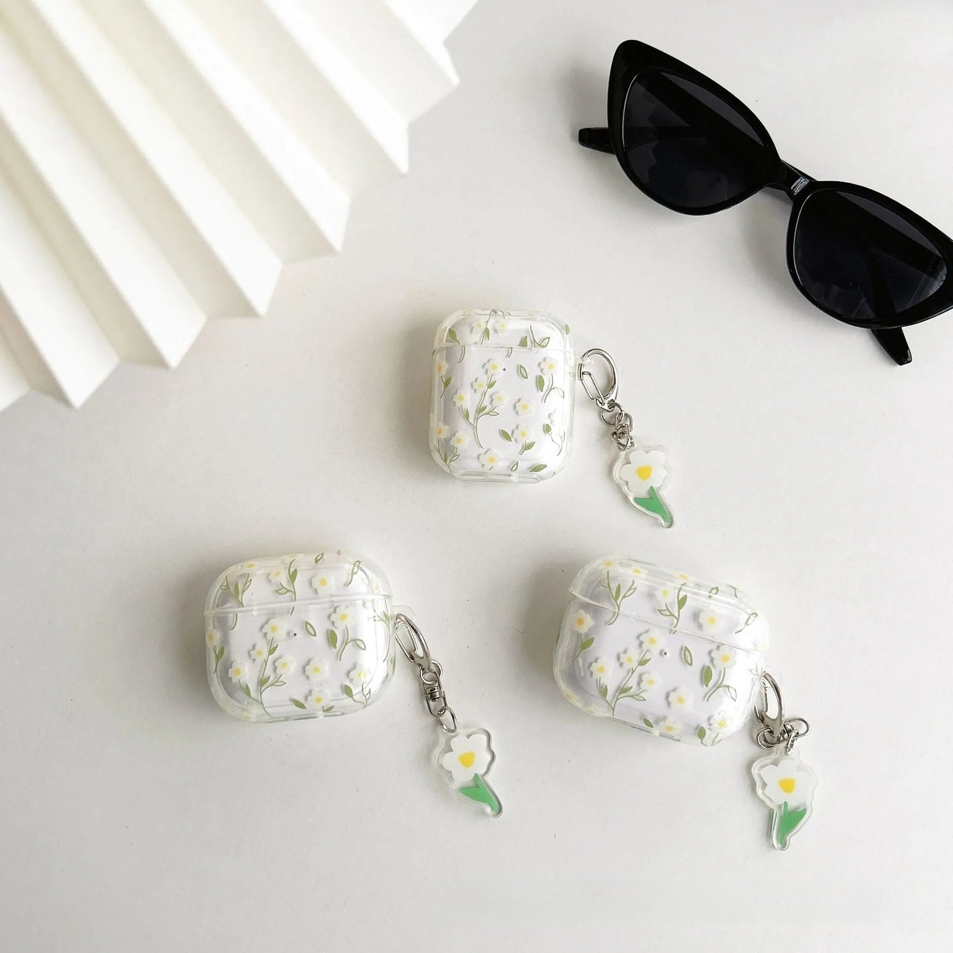 White floral pattern TPU protective cover for Apple AirPods charging case showing high transparency