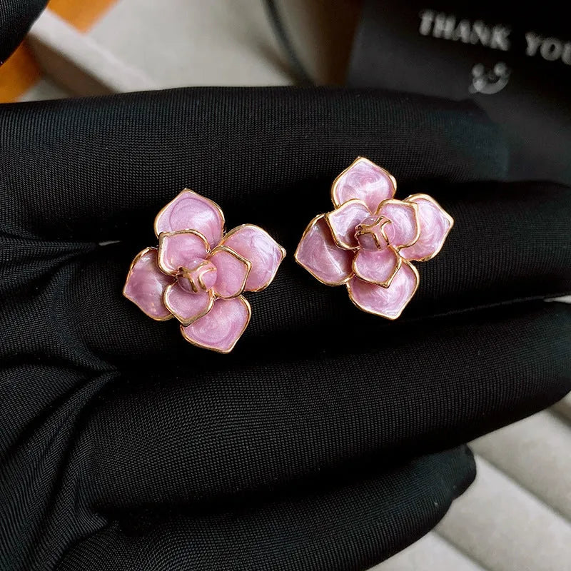 Gold plated purple oil-spot glaze floral stud earrings on copper base.