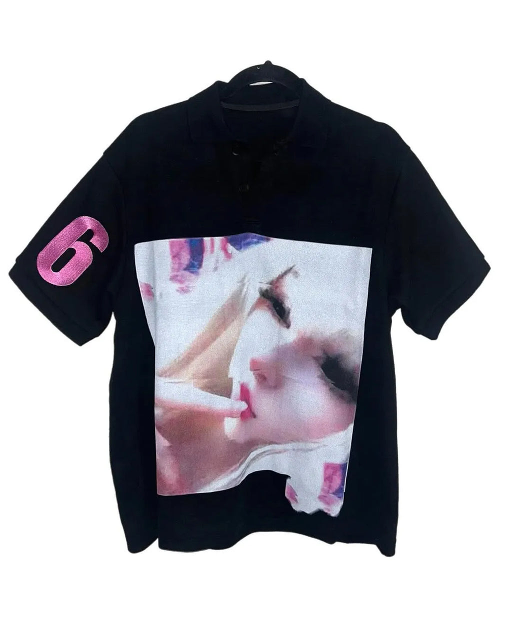 Men's short-sleeved printed polo shirt in a solid colour on a model.