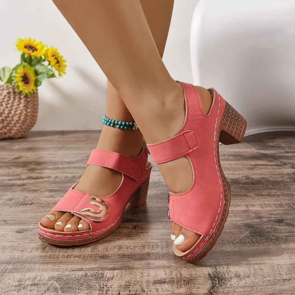 Women's light brown Roman sandals with Velcro strap fastening on a rubber sole.