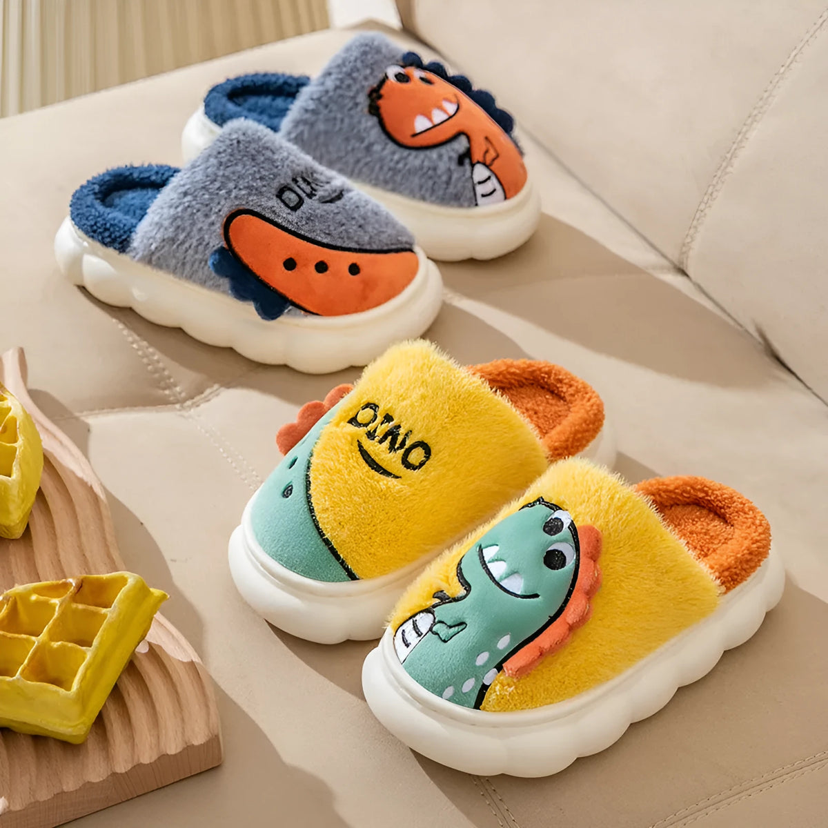 Cotton plush slippers with dinosaur print designs in grey, coffee, and orange colours for indoor couple wear