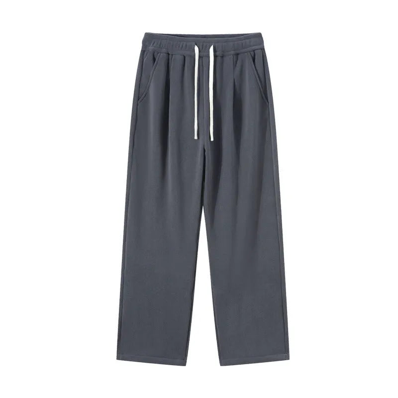 Men's apricot coloured loose-fit polar fleece winter trousers with a drawstring waist, shown flat.