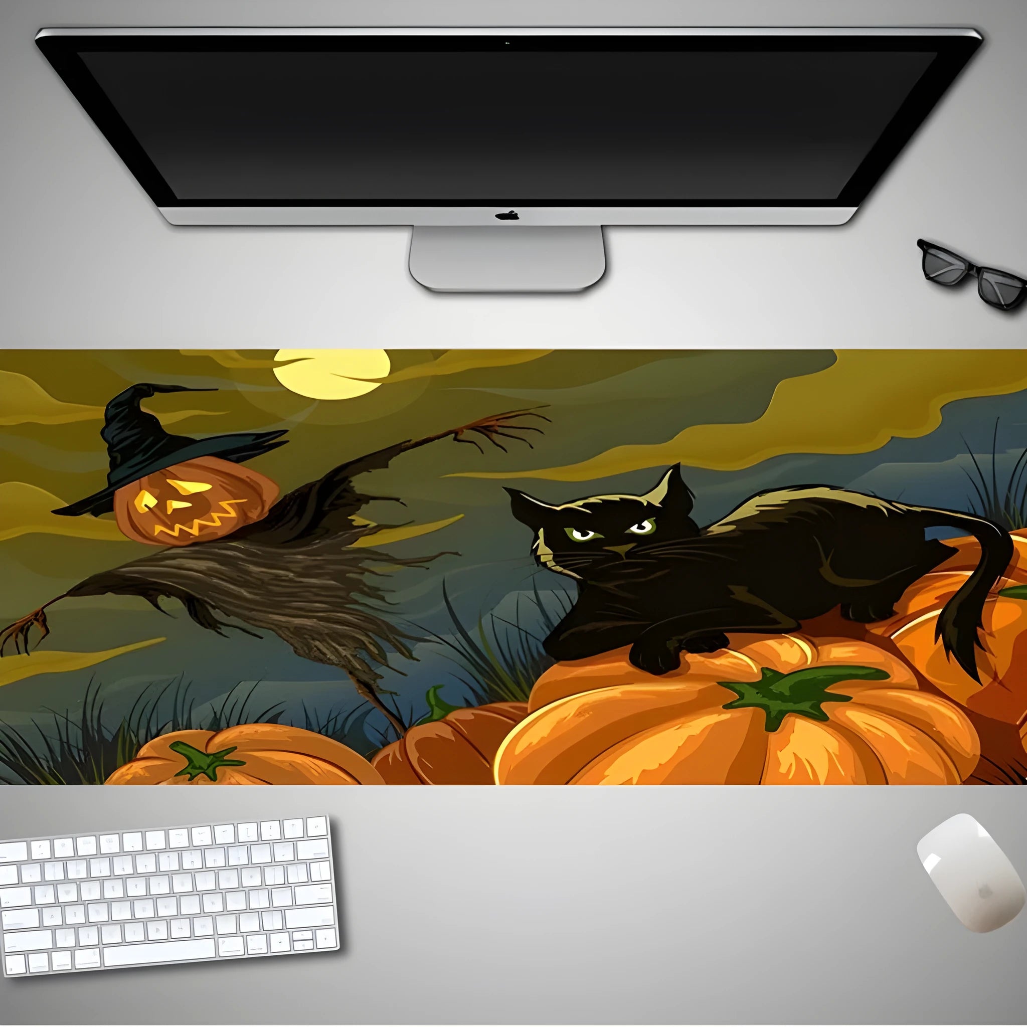 Oversized Halloween pattern mouse pad on a desk showing non-slip rubber base and cloth top.